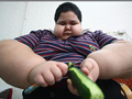 Fat Boy Eating cucumber